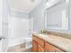 Updated bathroom featuring granite counters, tile floors, and a bathtub at 611 Church St, Belmont, NC 28012