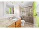 Updated bathroom featuring granite counters, tile floors, and glass shower at 611 Church St, Belmont, NC 28012