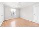 A bright bedroom with hardwood floors and a ceiling fan at 611 Church St, Belmont, NC 28012