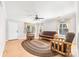 Bright living room featuring wood laminate flooring and natural light through the windows at 611 Church St, Belmont, NC 28012