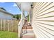 Covered side entry with steps and white railing at 611 Church St, Belmont, NC 28012