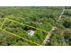 Aerial view of the property showcasing the home and surrounding trees, outlined in yellow at 7011 S Providence Rd, Waxhaw, NC 28173