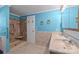 Bathroom featuring double sinks, walk-in shower with seating, and blue painted walls at 7011 S Providence Rd, Waxhaw, NC 28173