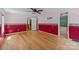 Bright bedroom featuring wood floors, large windows, and a ceiling fan; the perfect space to relax and unwind at 7011 S Providence Rd, Waxhaw, NC 28173