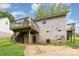 The backyard shows a two-story home with a wooden deck, storage shed, and partially fenced yard at 704 Willow Rd, Salisbury, NC 28147
