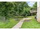 The property boasts a spacious yard with lush greenery, providing privacy and a serene natural backdrop at 704 Willow Rd, Salisbury, NC 28147