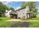 The backyard shows a two-story home with a wooden deck, storage shed, and partially fenced yard at 704 Willow Rd, Salisbury, NC 28147