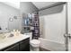 Functional bathroom with shower-tub combination, vanity, and storage shelf at 704 Willow Rd, Salisbury, NC 28147