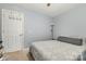 Neutral bedroom featuring light walls, modern decor, a ceiling fan, and a window at 704 Willow Rd, Salisbury, NC 28147