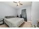 Neutral bedroom featuring light walls, modern decor, a ceiling fan, and a window at 704 Willow Rd, Salisbury, NC 28147