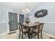 Dining area featuring a wooden table set with seating for four under decorative light fixture at 704 Willow Rd, Salisbury, NC 28147