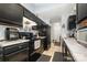 Kitchen with black cabinetry, stainless steel appliances and faux marble countertops at 704 Willow Rd, Salisbury, NC 28147