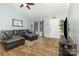 Spacious living room with vaulted ceiling, leather furniture, wood flooring and natural light at 704 Willow Rd, Salisbury, NC 28147