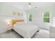 Bright bedroom with fresh white walls and accents, featuring stylish decor and lots of natural light at 7229 Olde Sycamore Dr, Mint Hill, NC 28227