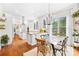 Bright and open kitchen flowing into a dining area with hardwood floors at 7229 Olde Sycamore Dr, Mint Hill, NC 28227