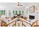 Living room boasts hardwood floors, fireplace, and abundant natural light from large windows at 7229 Olde Sycamore Dr, Mint Hill, NC 28227