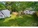 Well-maintained backyard with lush green lawn, storage shed, and privacy fencing for secluded enjoyment at 772 Eden Ter, Rock Hill, SC 29730