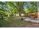 Large backyard features mature trees, storage shed, and patio for outdoor enjoyment and entertaining at 772 Eden Ter, Rock Hill, SC 29730
