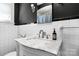 Elegant bathroom with a marble countertop, and vintage-style fixtures offering a timeless appeal at 772 Eden Ter, Rock Hill, SC 29730