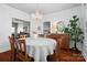 Elegant dining room featuring hardwood floors, a chandelier, and views of the living room and kitchen at 772 Eden Ter, Rock Hill, SC 29730
