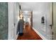 Hallway featuring hardwood floors, a decorative shelf, and access to a living area at 772 Eden Ter, Rock Hill, SC 29730