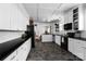 Modern kitchen featuring white cabinets, granite countertops, tile backsplash, and stainless steel appliances at 772 Eden Ter, Rock Hill, SC 29730
