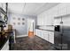 Spacious kitchen featuring white cabinets, granite countertops, tile backsplash, and stainless steel appliances at 772 Eden Ter, Rock Hill, SC 29730