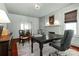 Well-lit living room with hardwood floors, a decorative fireplace, neutral walls and a view of the dining room at 772 Eden Ter, Rock Hill, SC 29730