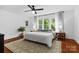 Serene main bedroom with natural light, hardwood floors, and a ceiling fan at 772 Eden Ter, Rock Hill, SC 29730