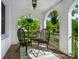Inviting front porch with wicker seating, brick flooring, and views of the lush surroundings at 772 Eden Ter, Rock Hill, SC 29730