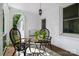 Charming front porch with brick flooring, outdoor seating, and stylish lighting fixture at 772 Eden Ter, Rock Hill, SC 29730