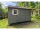 Outdoor storage shed featuring window and double doors, providing ample space for tools and equipment at 772 Eden Ter, Rock Hill, SC 29730