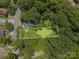 Aerial view of the property showcasing the lot lines, surrounded by lush trees and neighboring homes at 822 Cantwell St, Charlotte, NC 28208