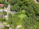 Aerial view of the property showcasing the lot lines, surrounded by lush trees and neighboring homes at 822 Cantwell St, Charlotte, NC 28208