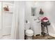 Functional bathroom with a combined shower and tub, toilet, and a small vanity at 822 Cantwell St, Charlotte, NC 28208