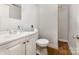 Standard bathroom with a sink, toilet, and mirror, providing essential amenities at 822 Cantwell St, Charlotte, NC 28208