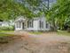 View of a cozy single-story home with a spacious yard at 822 Cantwell St, Charlotte, NC 28208
