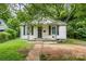 Charming single-story home with white siding and a welcoming front porch at 822 Cantwell St, Charlotte, NC 28208