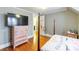 Bedroom featuring hardwood floors, a dresser, and a four poster bed at 904 Venus St, Kannapolis, NC 28083