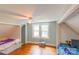 Bright bedroom with hardwood floors, a ceiling fan and built-in beds on both sides of the room at 904 Venus St, Kannapolis, NC 28083