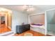 This bedroom boasts hardwood floors, built-in beds and a ceiling fan at 904 Venus St, Kannapolis, NC 28083