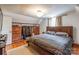 Well-lit bedroom with hardwood floors, built-in closet and a comfortable queen-size bed at 904 Venus St, Kannapolis, NC 28083