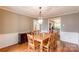 Classic dining room with hardwood floors, wood table and seating for eight at 904 Venus St, Kannapolis, NC 28083
