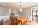 Inviting dining room, perfect for entertaining, with hardwood floors and view to the kitchen at 904 Venus St, Kannapolis, NC 28083