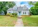 Charming two-story home with a well-maintained lawn and a bright blue front door at 904 Venus St, Kannapolis, NC 28083