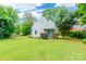 Charming home with a blue front door, well manicured front yard and mature trees at 904 Venus St, Kannapolis, NC 28083