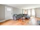 Inviting living room featuring hardwood floors, neutral walls, and a comfortable sectional sofa at 904 Venus St, Kannapolis, NC 28083