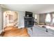 Hardwood floors, fireplace, and open floorplan provide great character to this living room at 904 Venus St, Kannapolis, NC 28083