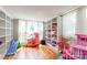 Bright playroom featuring hardwood floors, built-in bookshelves, and lots of natural light at 904 Venus St, Kannapolis, NC 28083