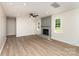 Bright living room featuring a stylish fireplace, modern ceiling fan, and neutral wall colors, creating a welcoming space at 9410 Mountain Aire Cir, Charlotte, NC 28214